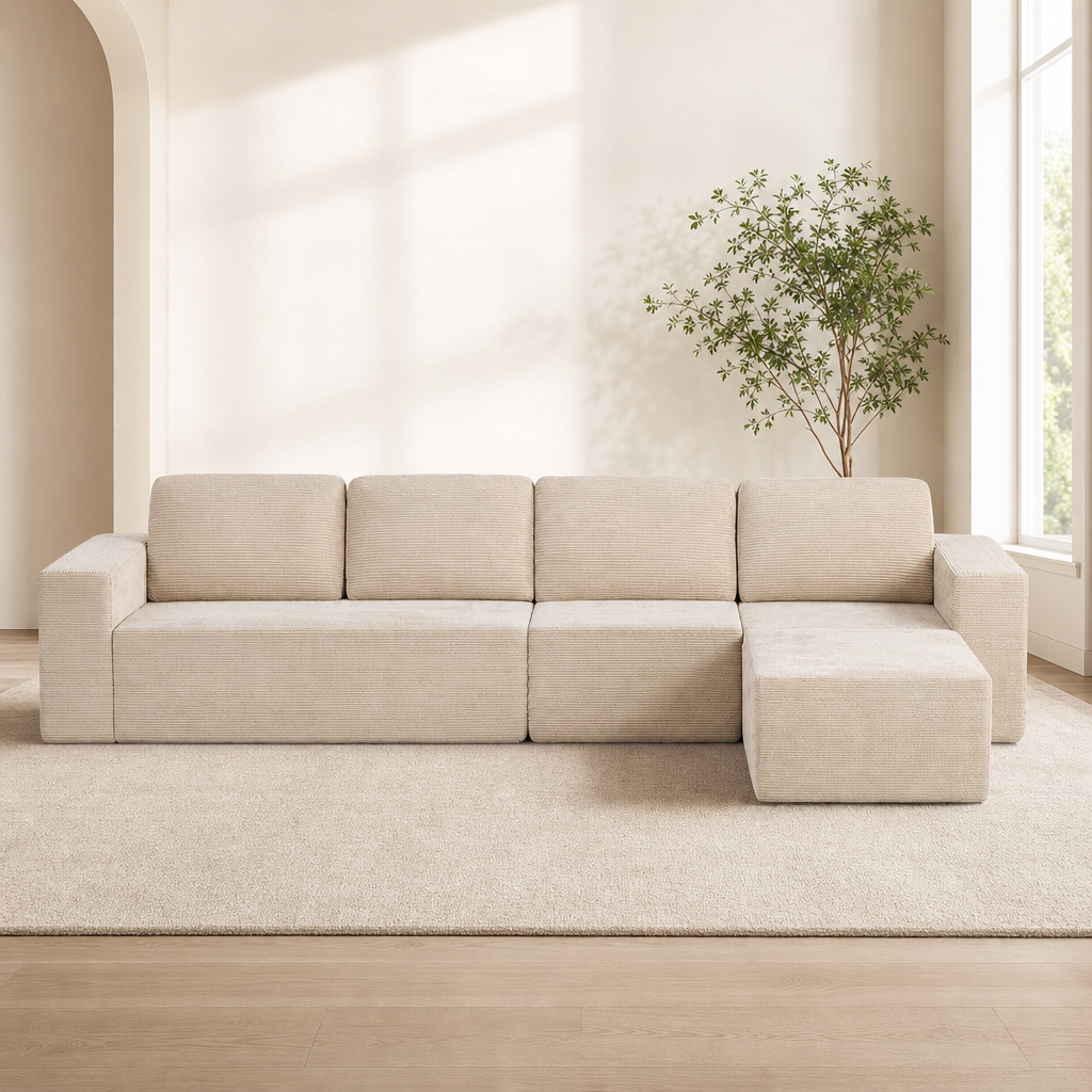 Beige corduroy modular sectional with right-side chaise, front view in a bright living room