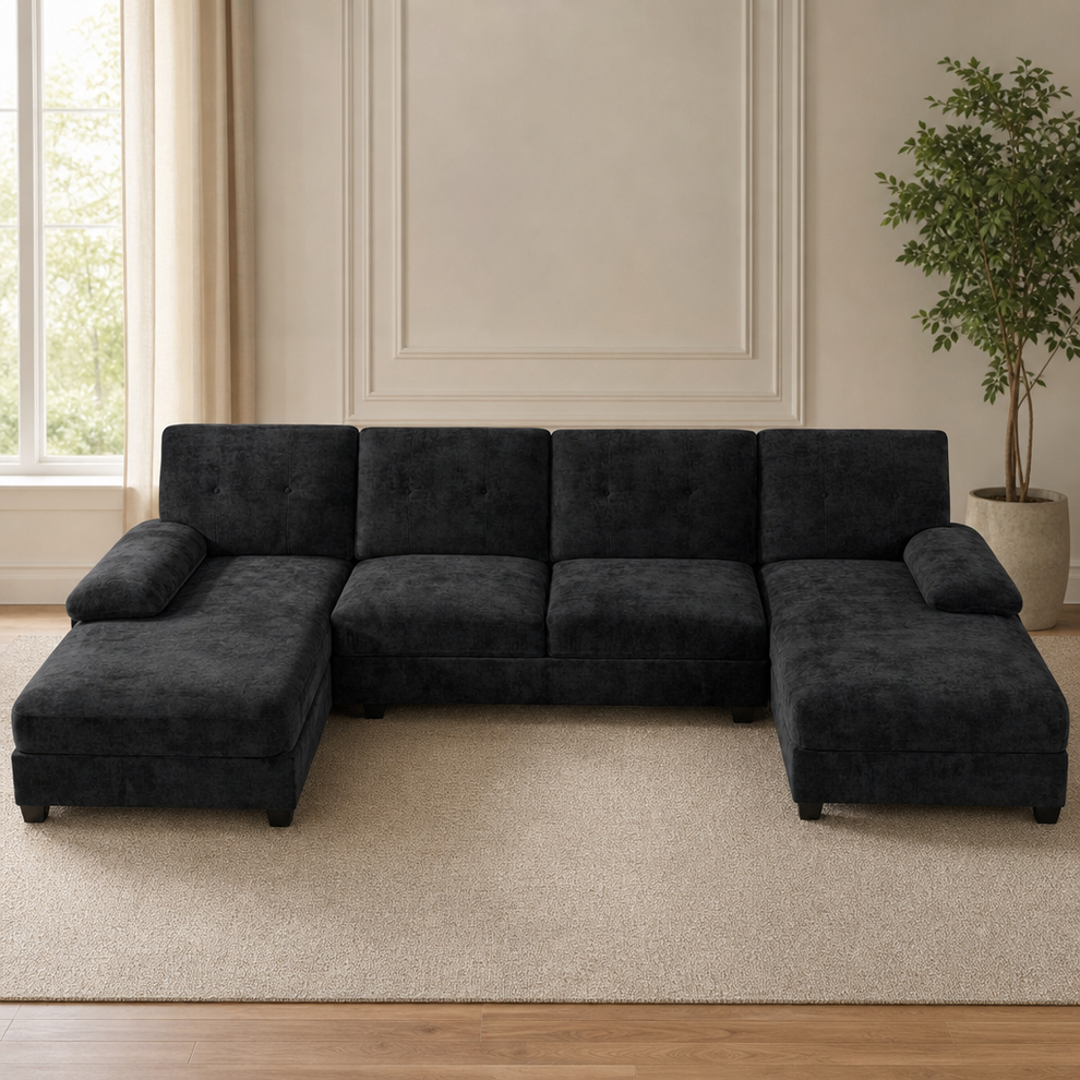 Black U-shaped 4-seat sectional with double chaise, front view in a bright living room