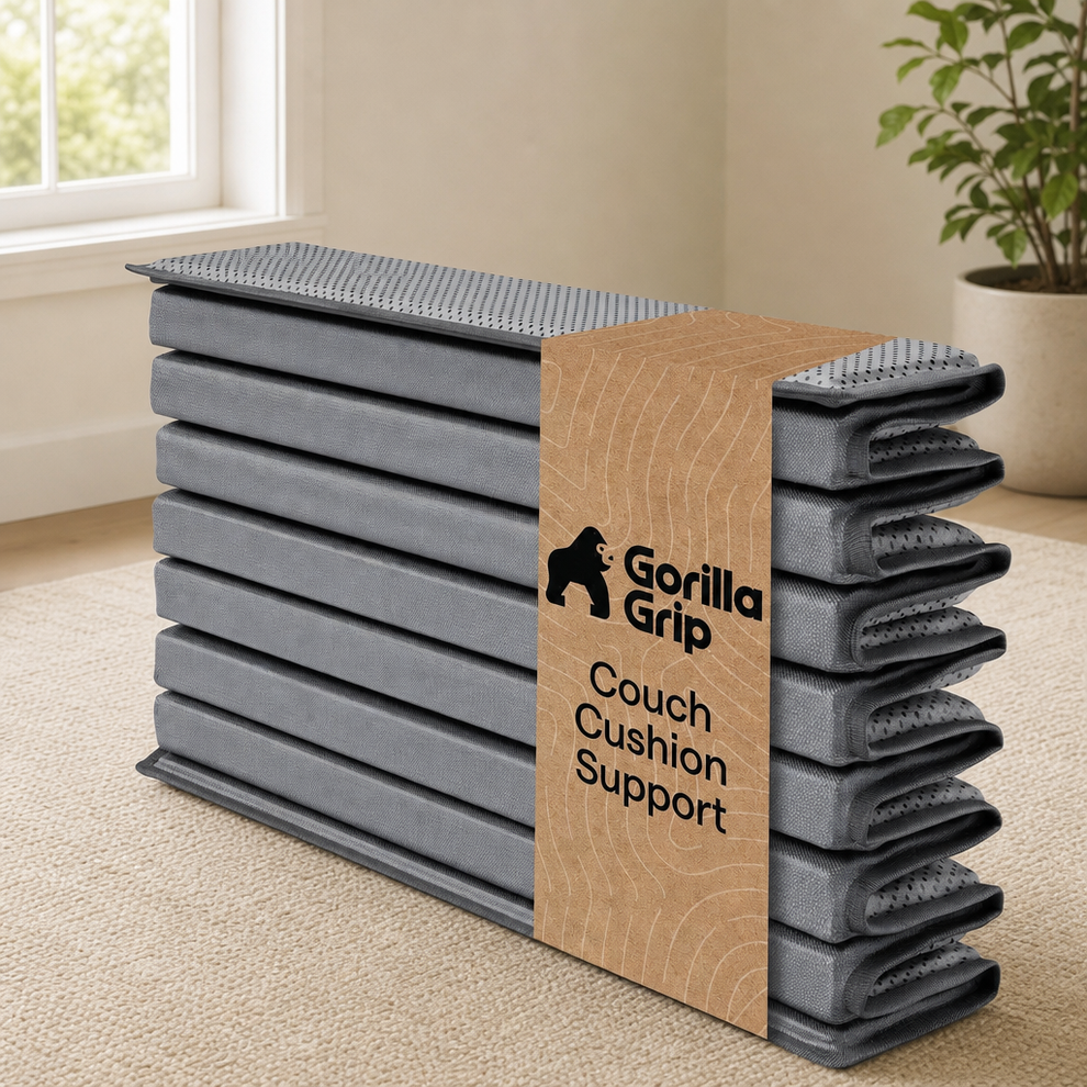 Folded grey sofa support board stacked with a kraft band in a bright living room setting