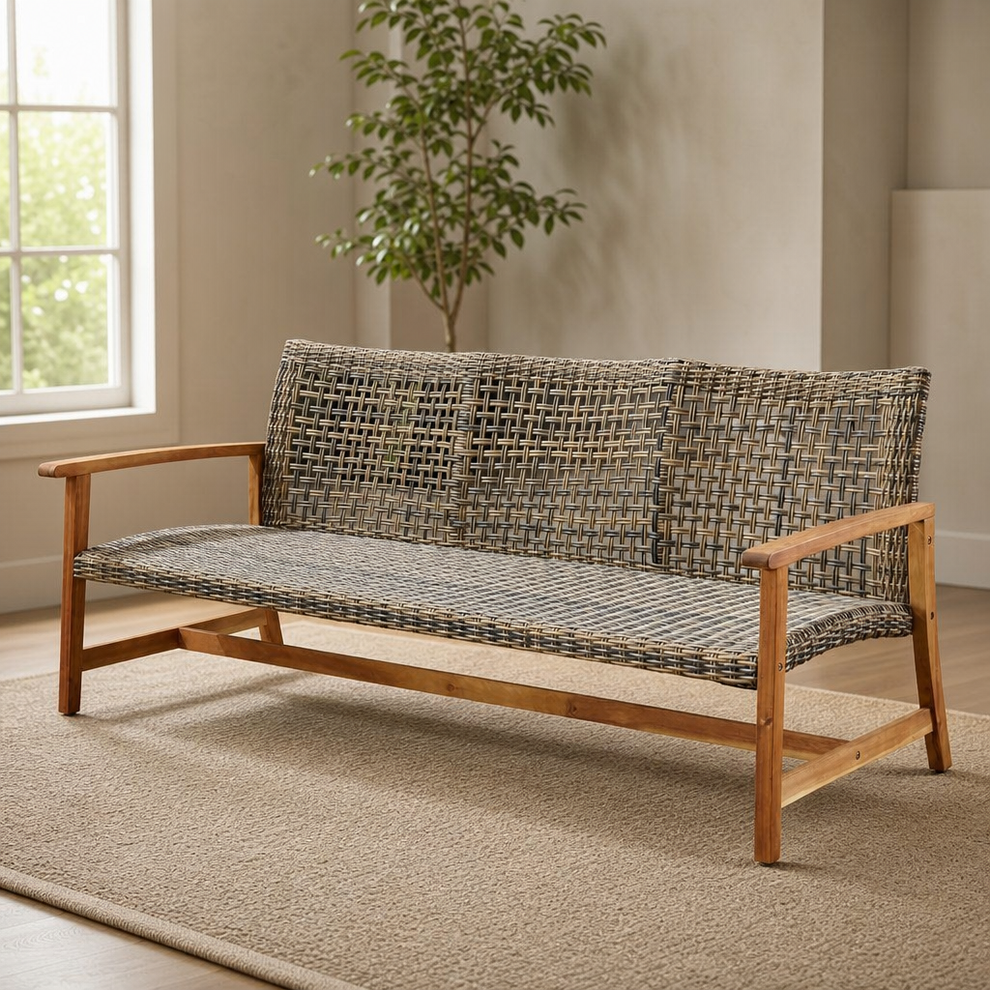 Three-seat woven faux-rattan sofa with acacia wood frame angled front view on a neutral rug