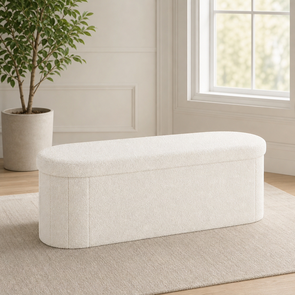 Sherpa Oval Collapsible Storage Ottoman Bench with Concealed Storage centered in a warm neutral furnished room