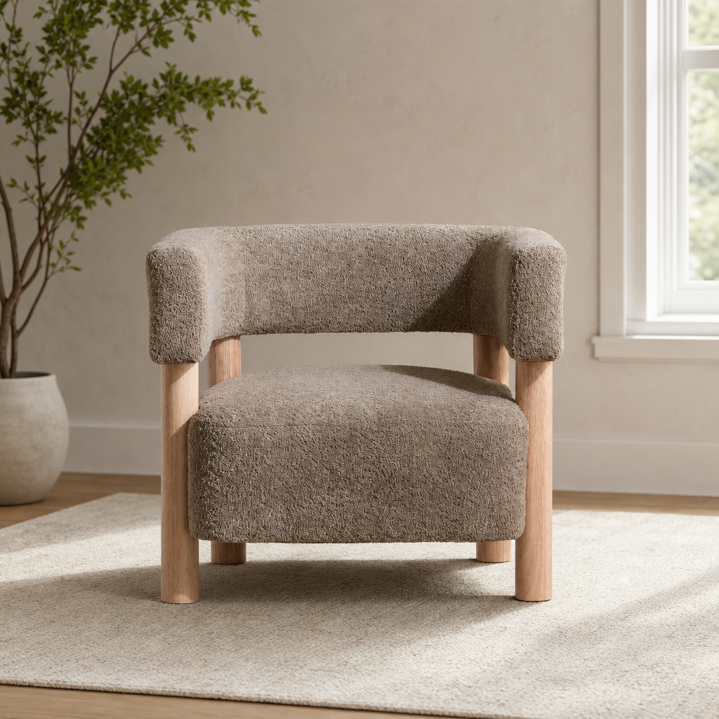 Light camel boucle accent chair front view showing rounded back and light wood legs on a neutral rug