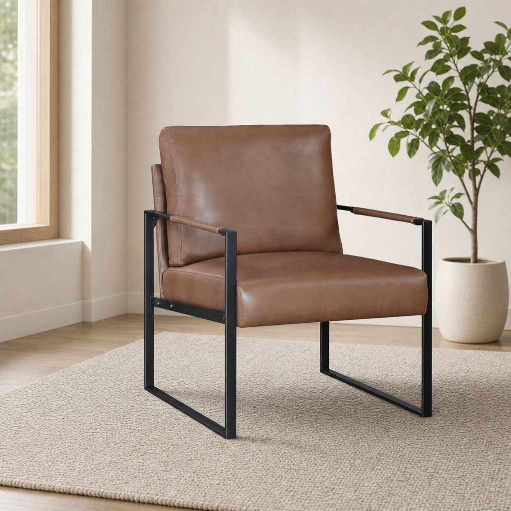 Brown faux leather accent armchair angled front-left with black metal frame on a neutral rug and potted plant