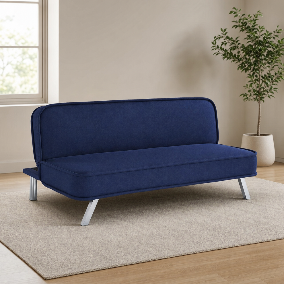Navy convertible futon sofa angled front-left view on a light rug showing chrome legs
