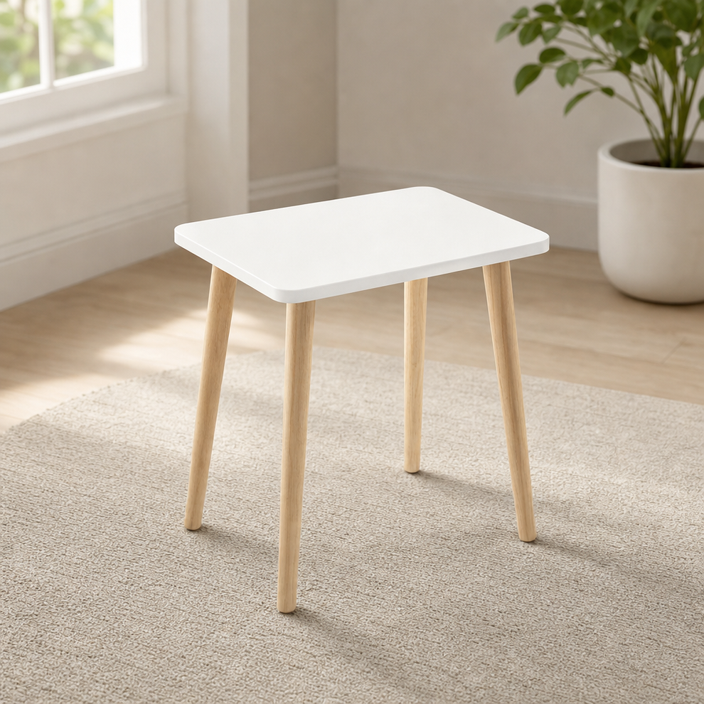 White square side table with natural tapered wood legs, front three-quarter view on a textured rug
