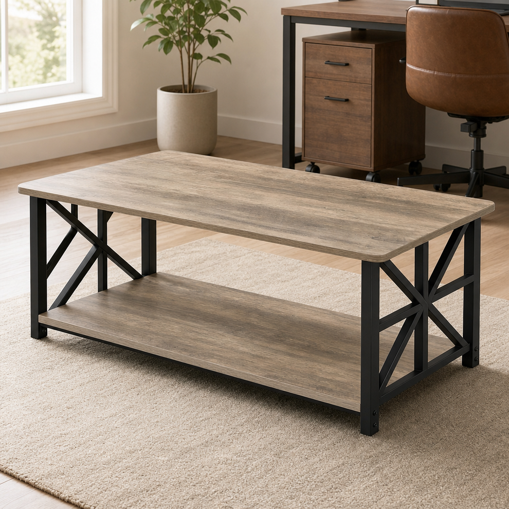 Rectangular farmhouse coffee table in oak-tone wood finish with black X-frame metal legs, angled front view on a neutral rug.