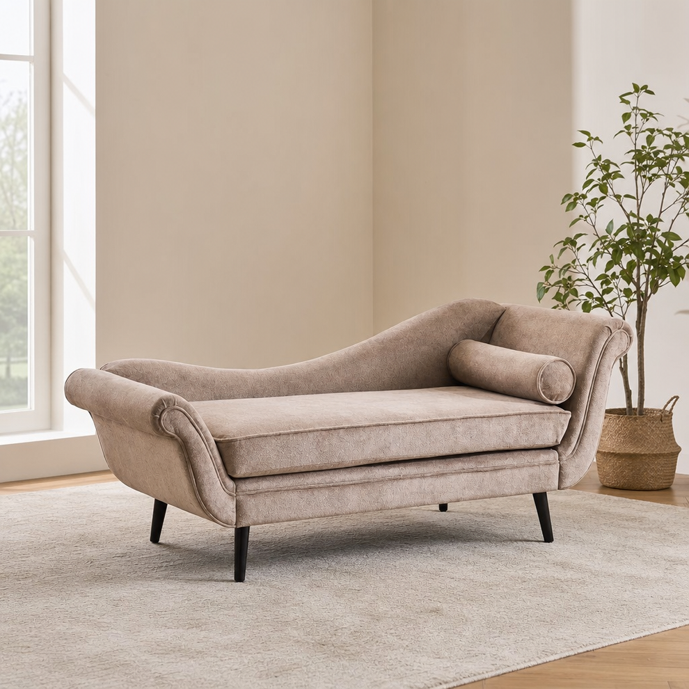 Mid-Century Velvet Upholstered Chaise Lounge with Accent Pillow, Birch Wood Frame centered in a warm neutral furnished room