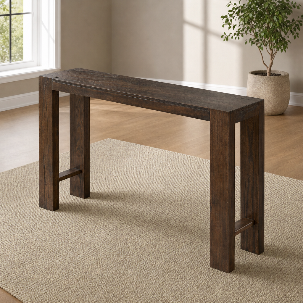 Brown solid pine narrow console table angled front view on a rug in a bright room