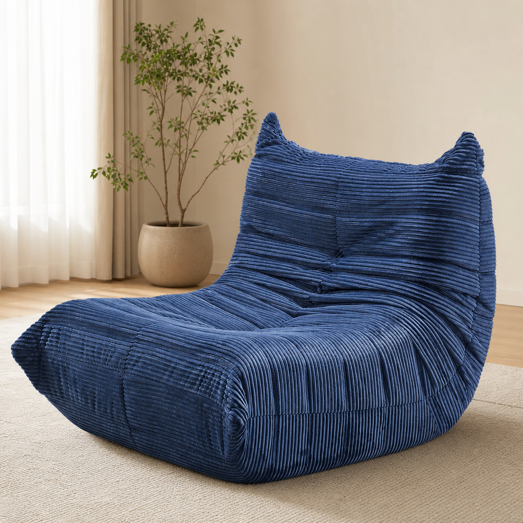 Blue corduroy-style teddy velvet bean bag chair angled front view in a sunlit living room