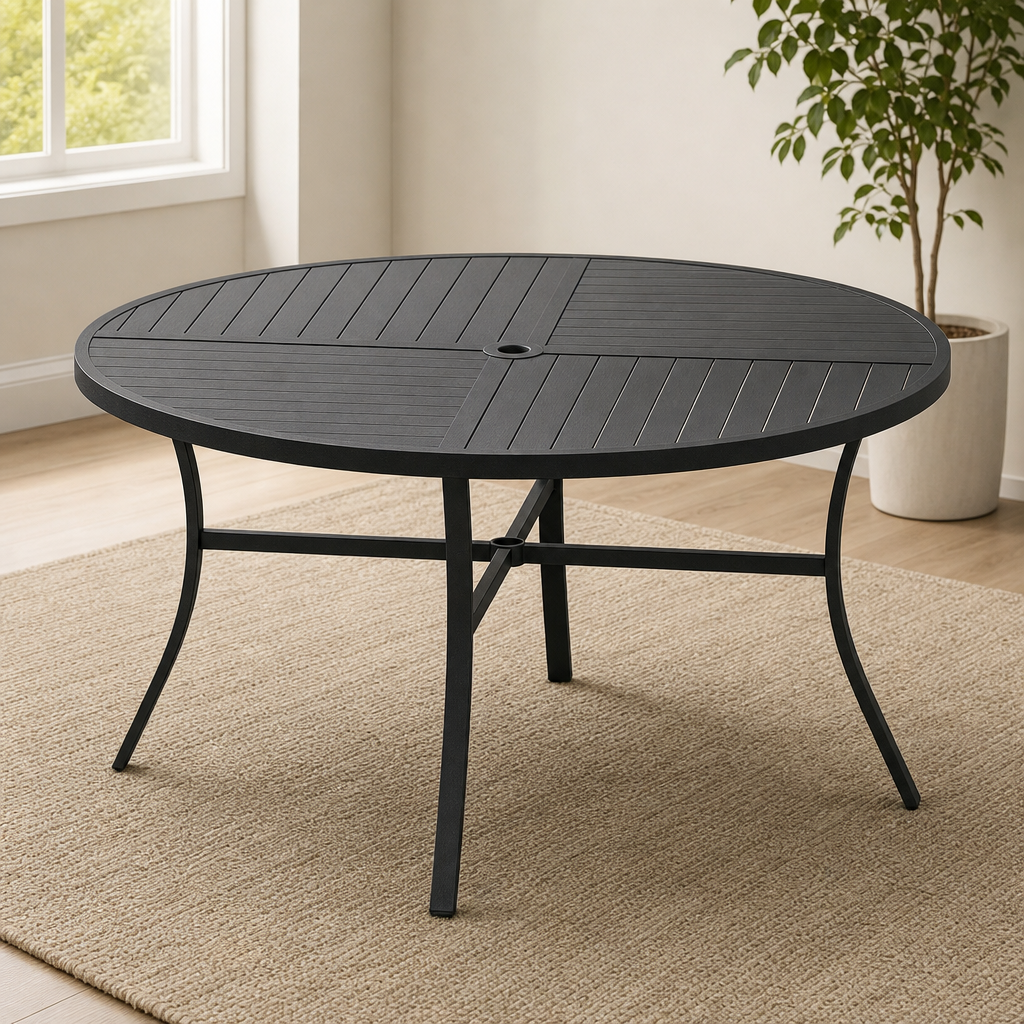 Black round metal patio dining table with slatted top, angled front view on a woven indoor rug