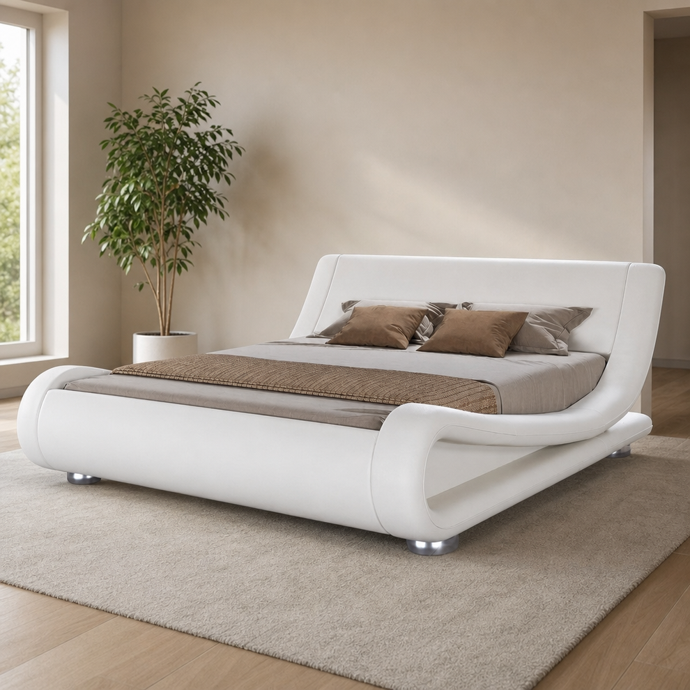 White faux leather wave platform bed angled front-left view on beige rug in a bright bedroom