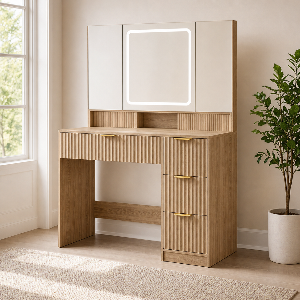 Fluted wood-finish vanity desk with LED-lit tri-fold mirror, front-left angled view