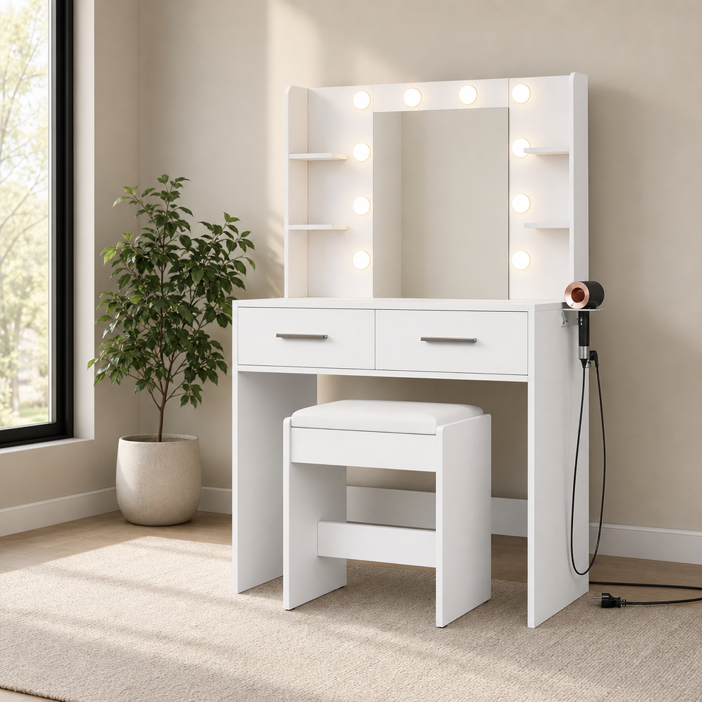 White vanity desk with LED-bulb mirror, bench tucked underneath and hair-dryer holder on right.