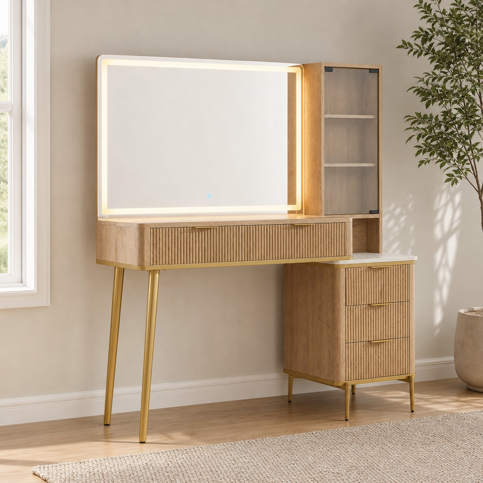 Light wood 36-inch vanity with illuminated rectangular frameless mirror, fluted panels and gold metal legs, angled front view