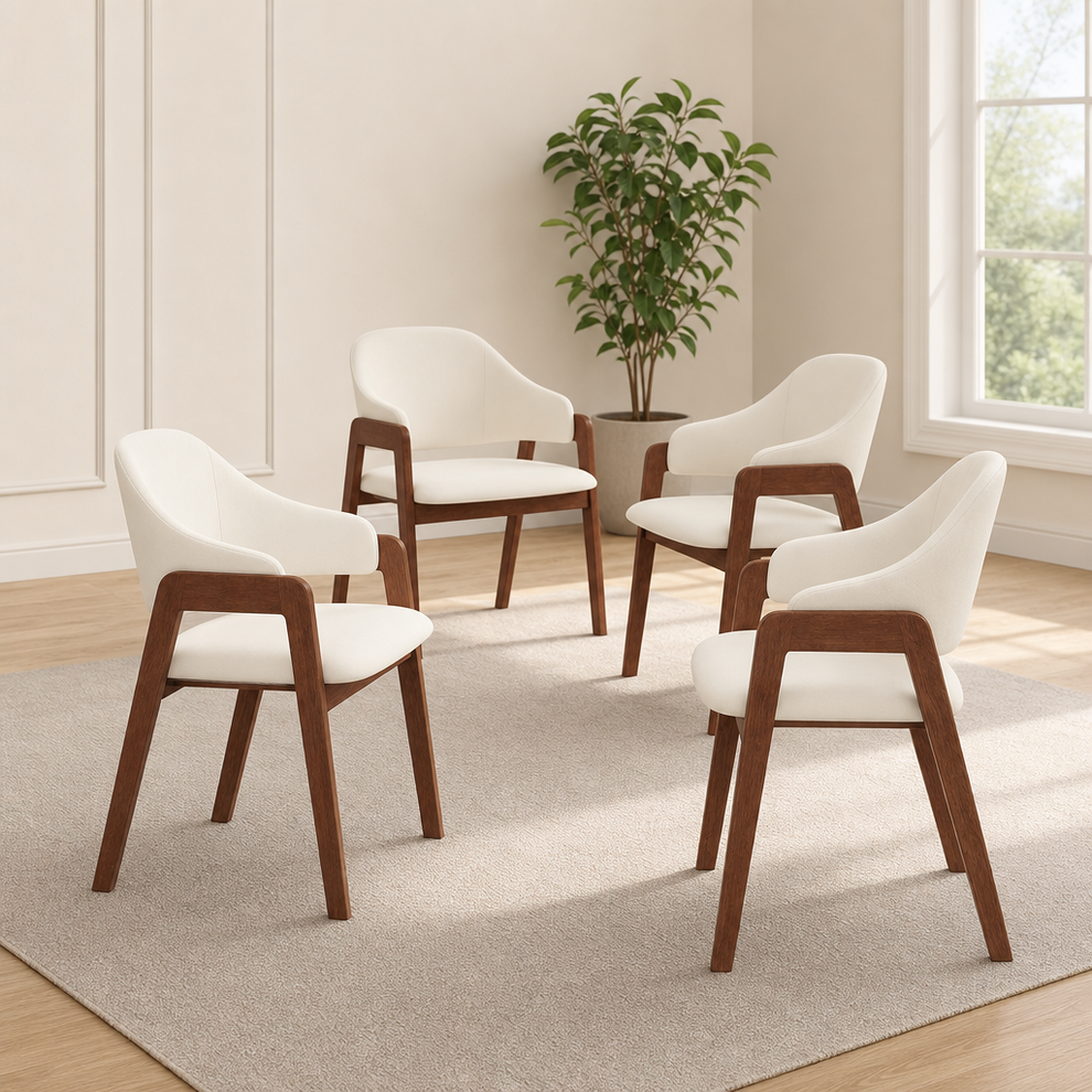 Beige upholstered dining chairs with walnut-tone wood frame arranged on a neutral rug, angled front view