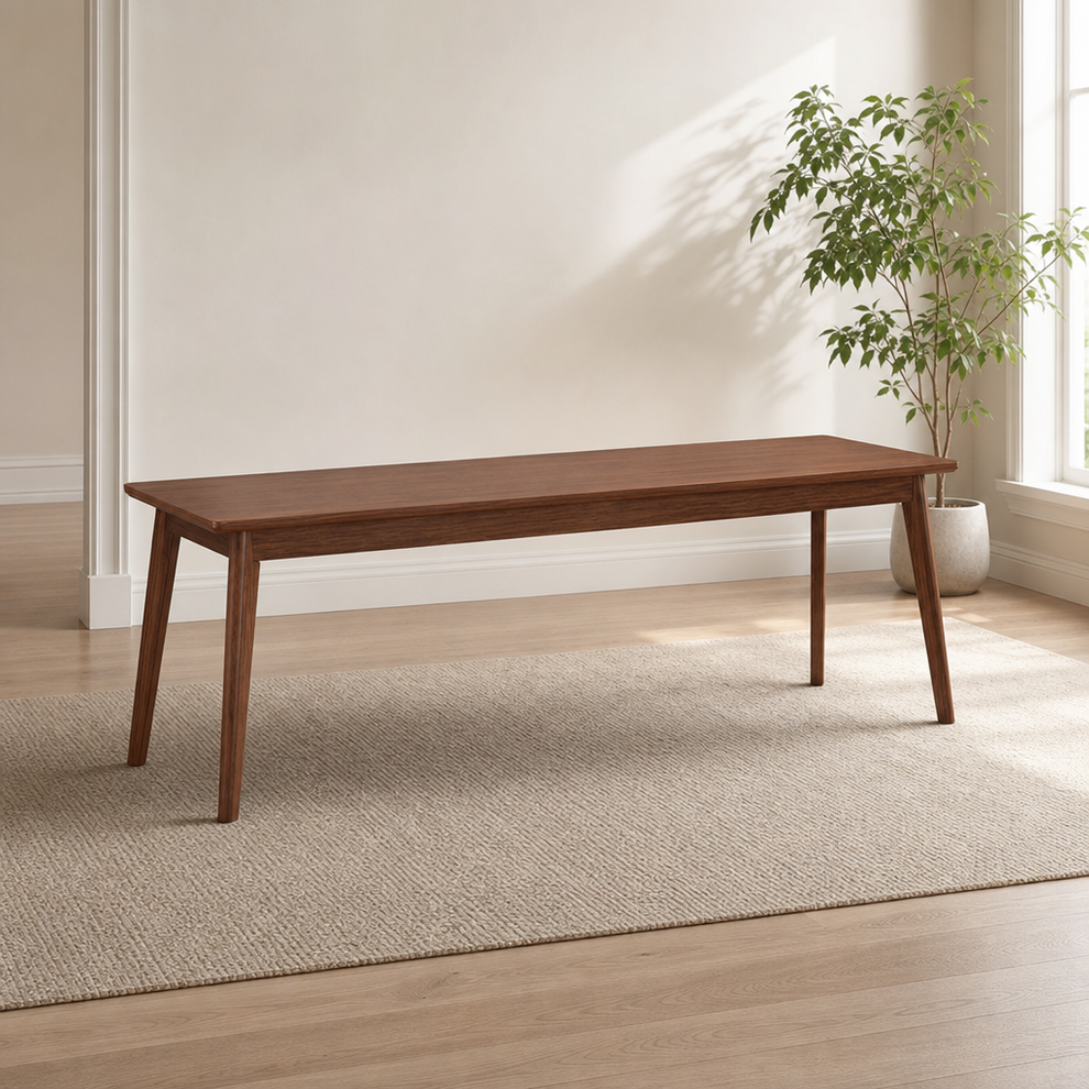 Walnut long desk full view in a bright room, angled front-left on a neutral rug