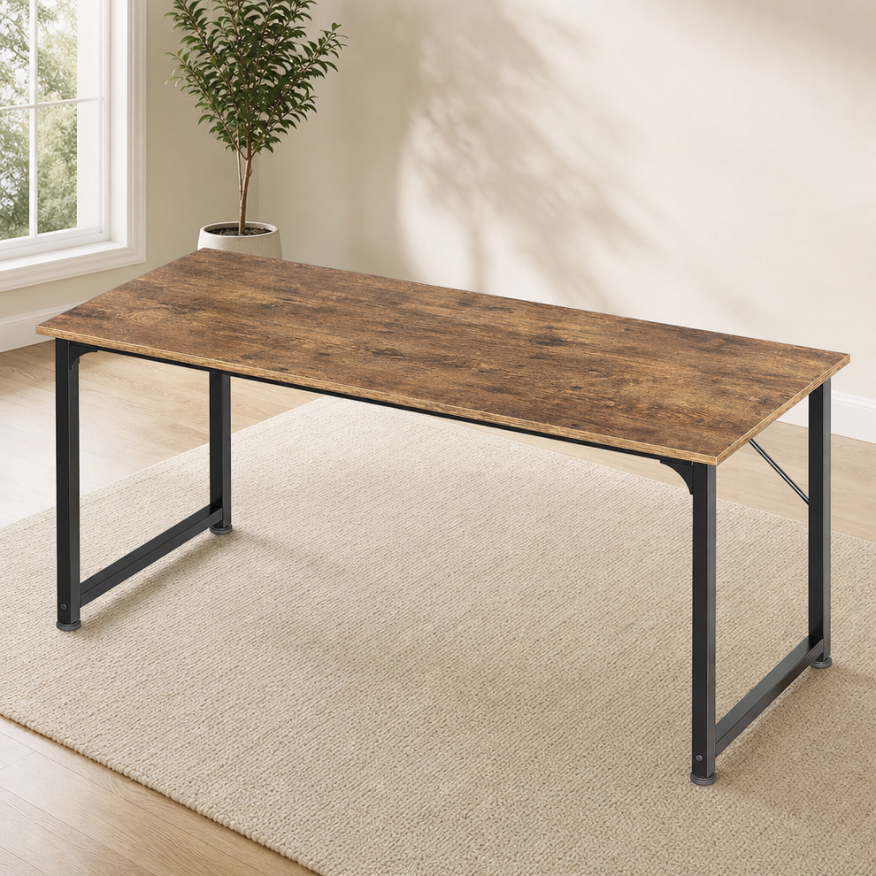 Rustic brown writing desk with black steel frame, angled front view on a light rug in a bright room