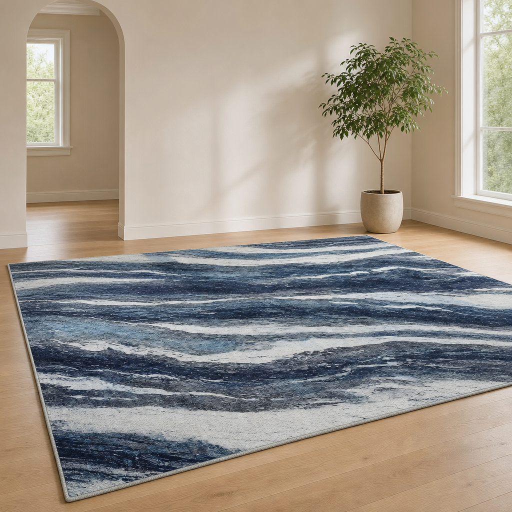 8' x 10' Faux Cashmere Area Rug — Blue Abstract Coastal, Low Pile, Non-Slip centered in a warm neutral furnished room