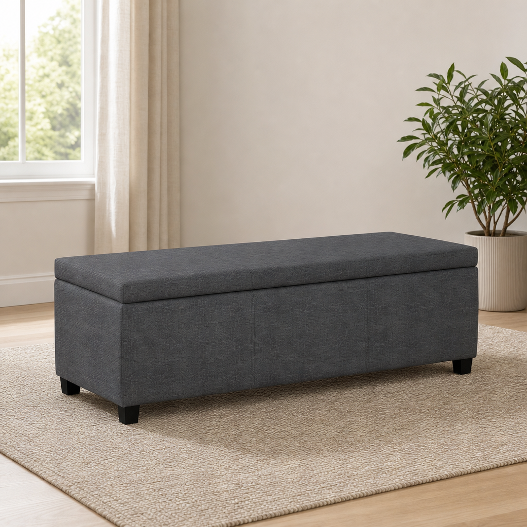 Slate grey linen-look storage ottoman bench angled front view on rug in a bright room