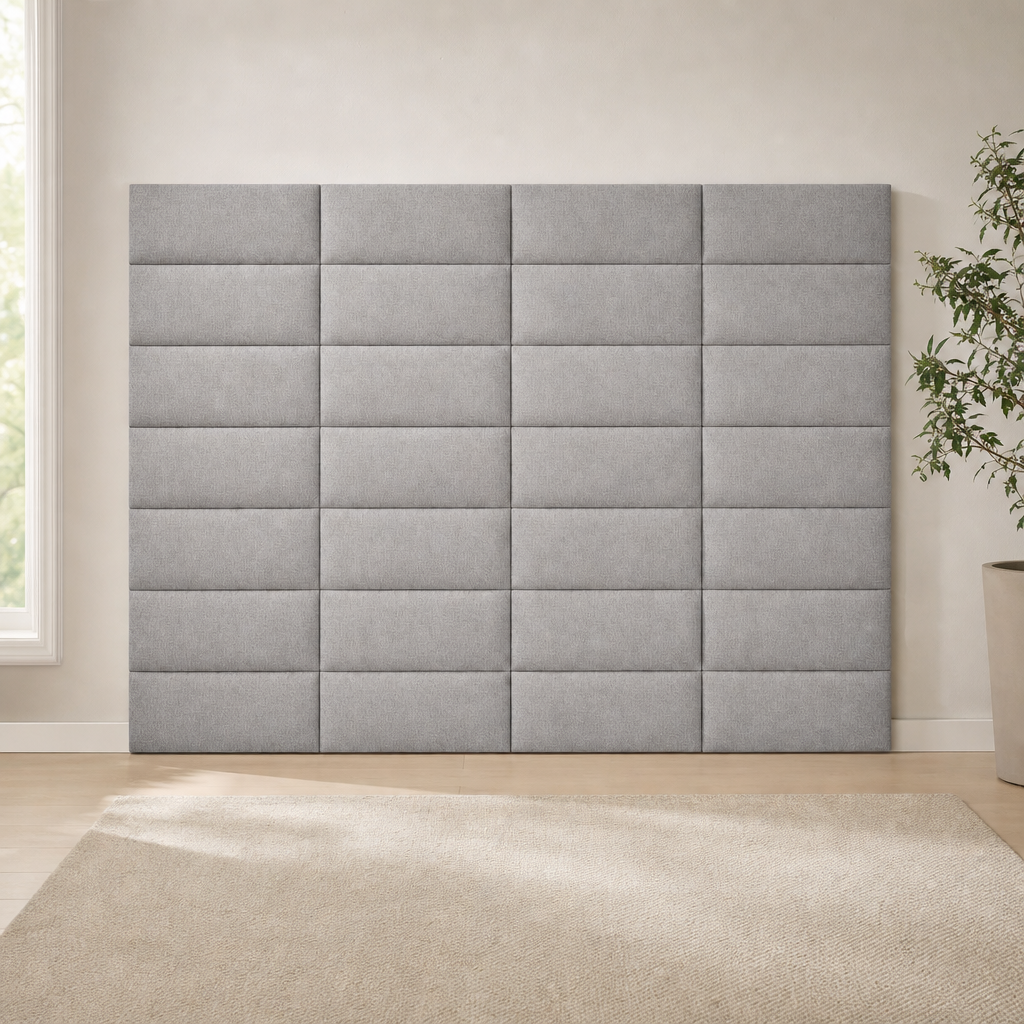 Medium gray fabric headboard panels assembled into a large square grid mounted full-front on a beige wall