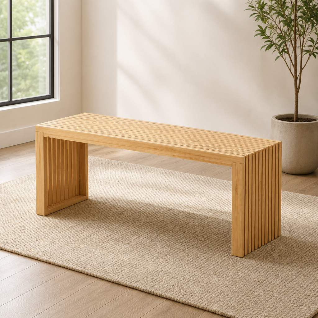 Natural bamboo slatted bench angled front view on a rug near a large window in a bright room