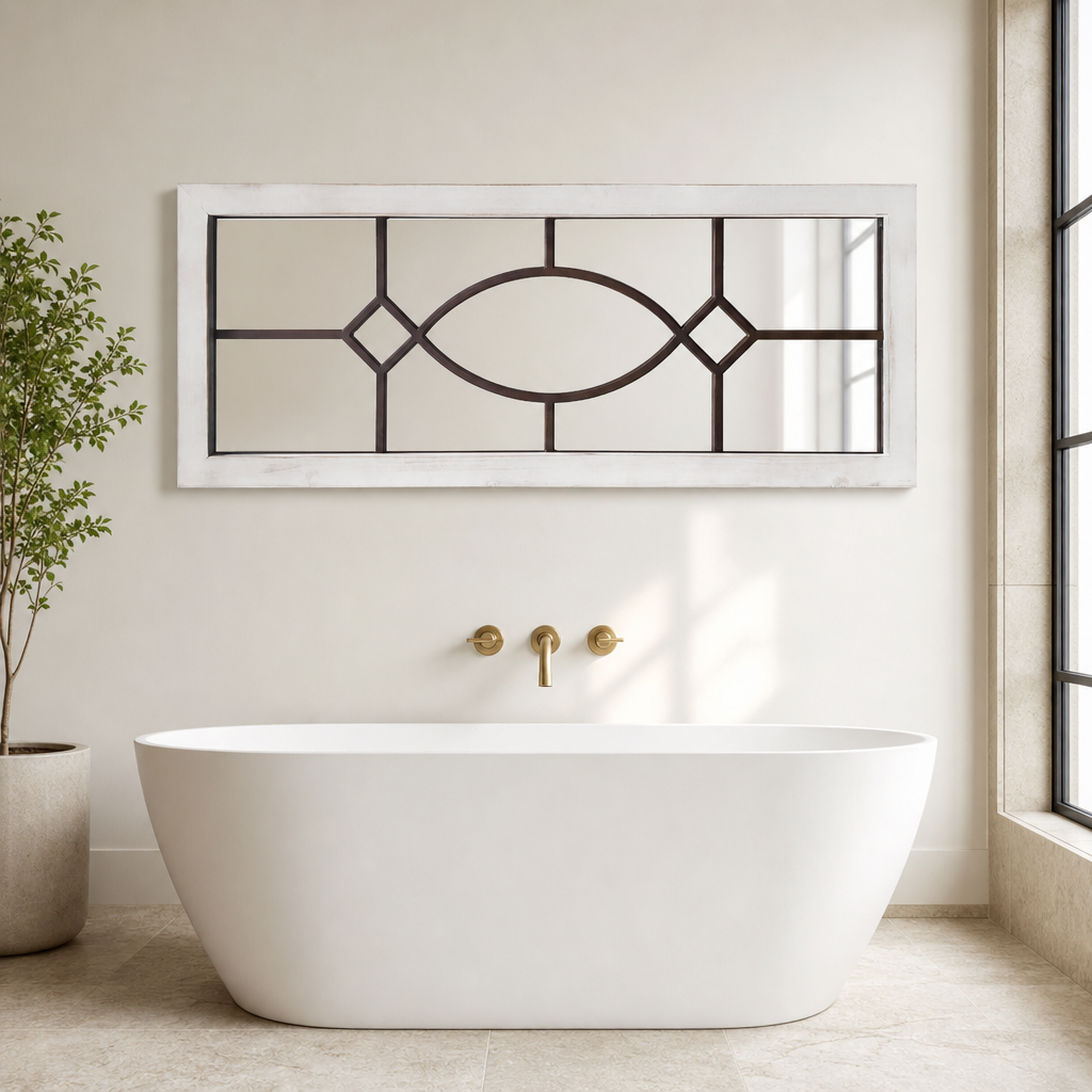 Rectangular distressed white wood framed windowpane mirror above a freestanding bathtub in a bright bathroom