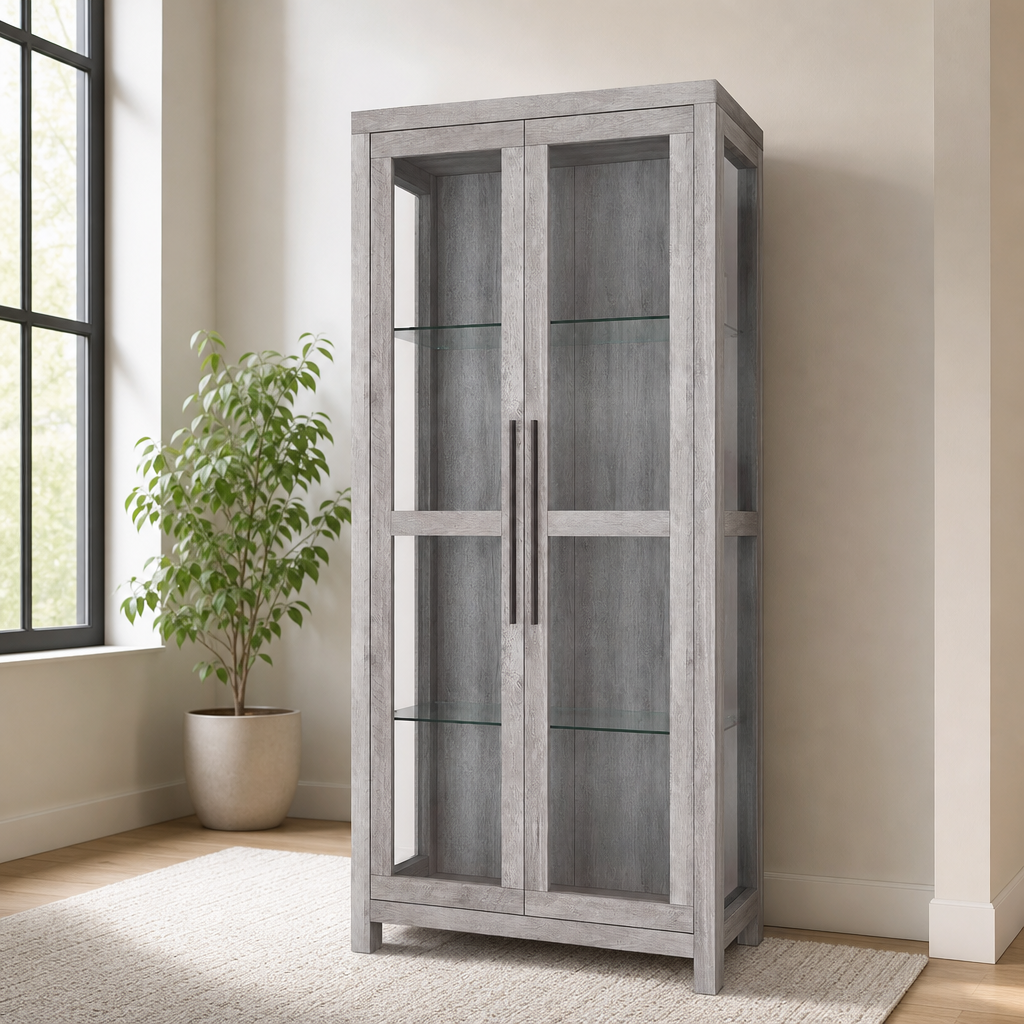 68" Glass Display Cabinet — Manufactured Wood, Tempered Glass Shelves, Gray Wash centered in a warm neutral furnished room