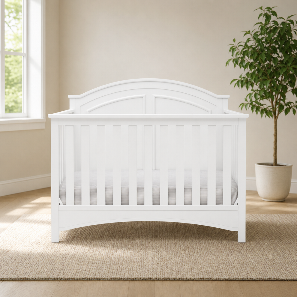 6-in-1 Convertible Crib, GREENGUARD Gold Certified centered in a warm neutral furnished room