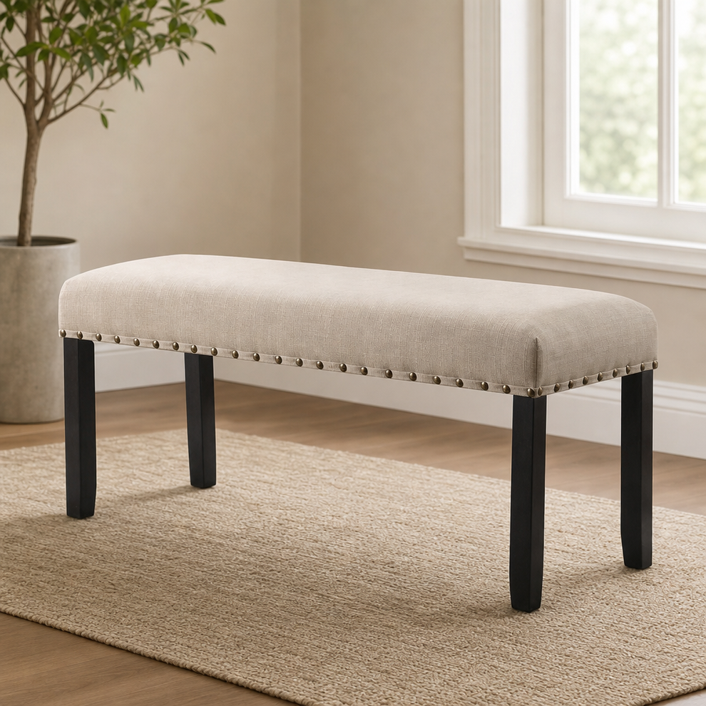 Upholstered Dining Bench with Nailhead Trim, 44 in, Tan centered in a warm neutral furnished room