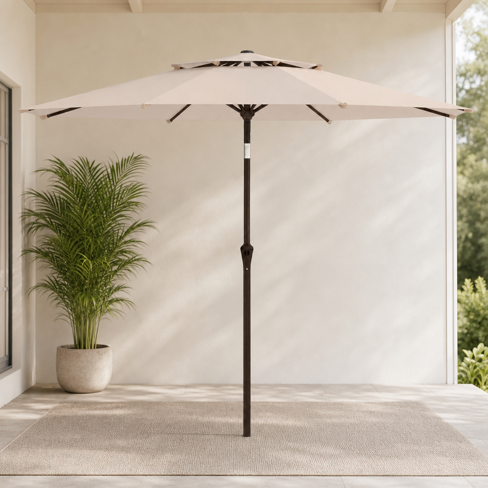 10ft Patio Umbrella, Solution-Dyed Polyester Canopy, 2-Tier Vented, Crank & Tilt centered in a warm neutral furnished room