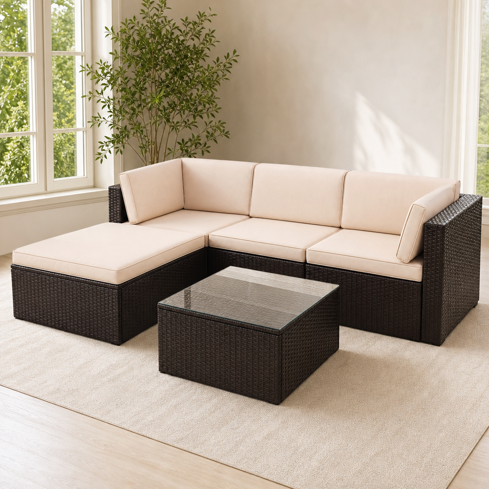 5-Piece PE Wicker Outdoor Sectional Sofa Set with Tempered Glass Coffee Table, Bei centered in a warm neutral furnished room