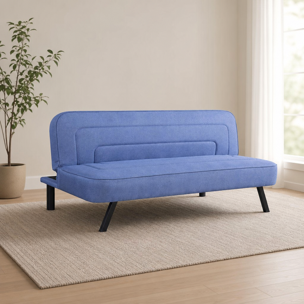 Serta Upholstered Convertible Futon Sofa — High-Density Foam, Metal Legs centered in a warm neutral furnished room