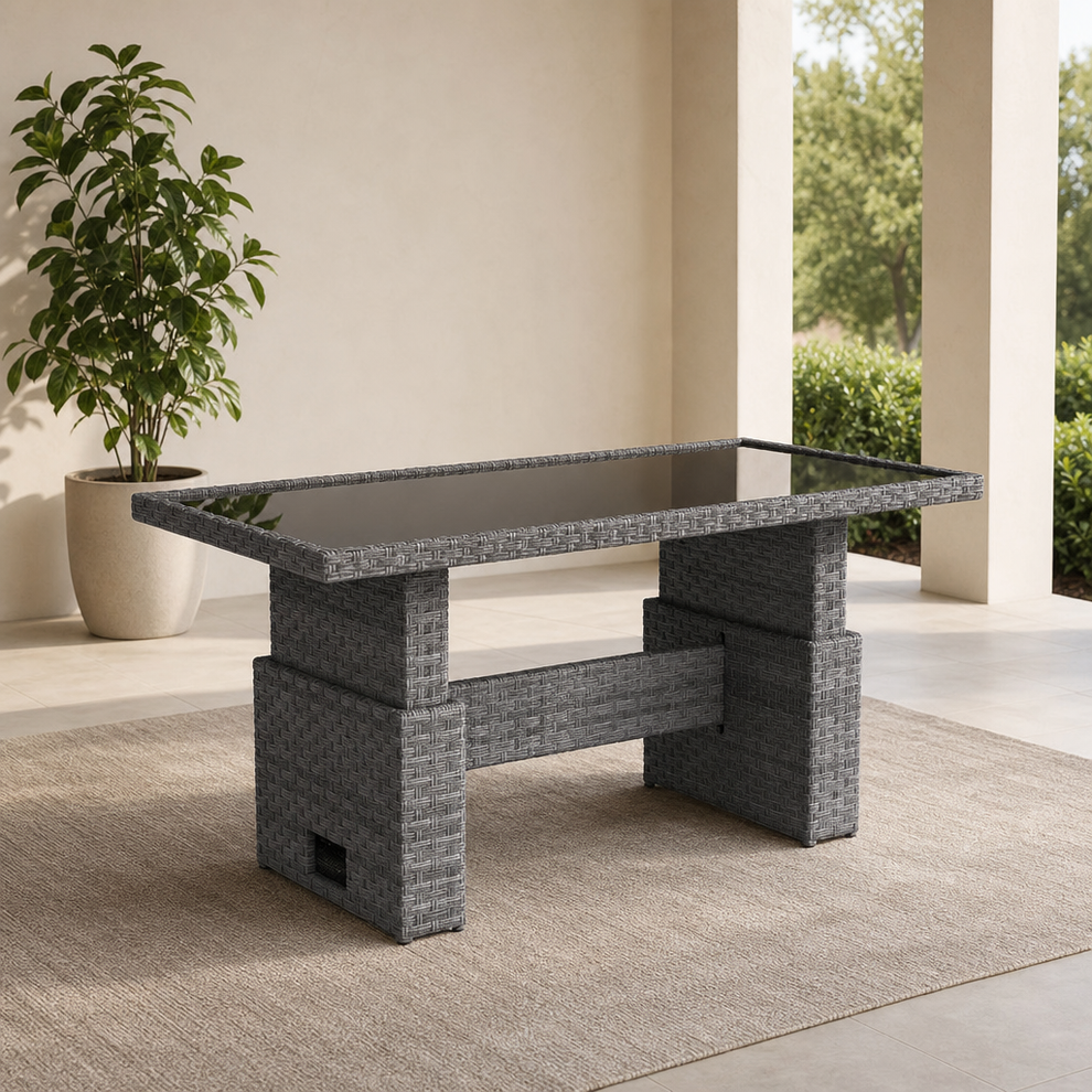 Rectangular Lift-Top Outdoor Table — Grey Resin Wicker with Glass Top centered in a warm neutral furnished room