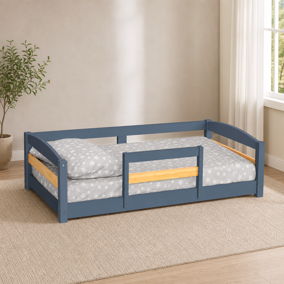 Montessori Floor Bed with Removable Guardrail — Fits Standard Crib Mattress centered in a warm neutral furnished room