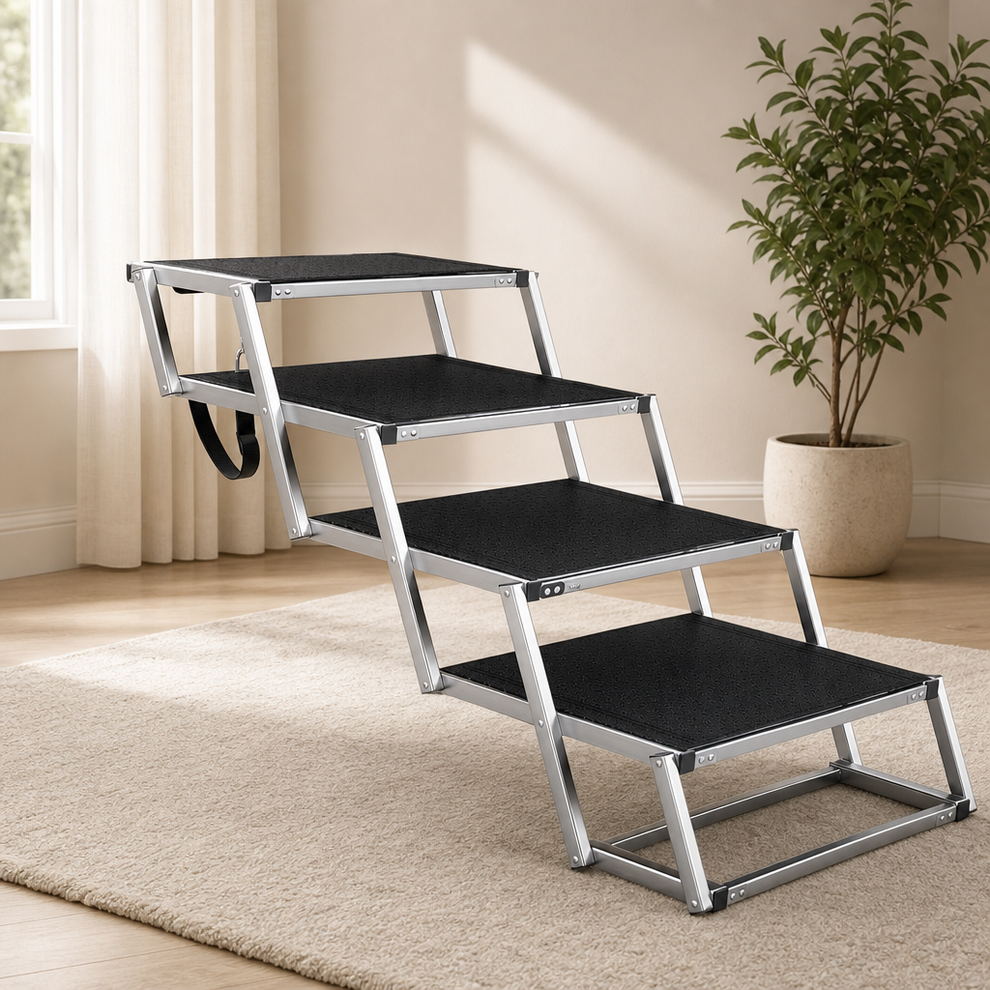 Foldable 4-Step Dog Stairs — Aluminum Frame, Paw-Print Non-Slip Treads, Foam Carry centered in a warm neutral furnished room