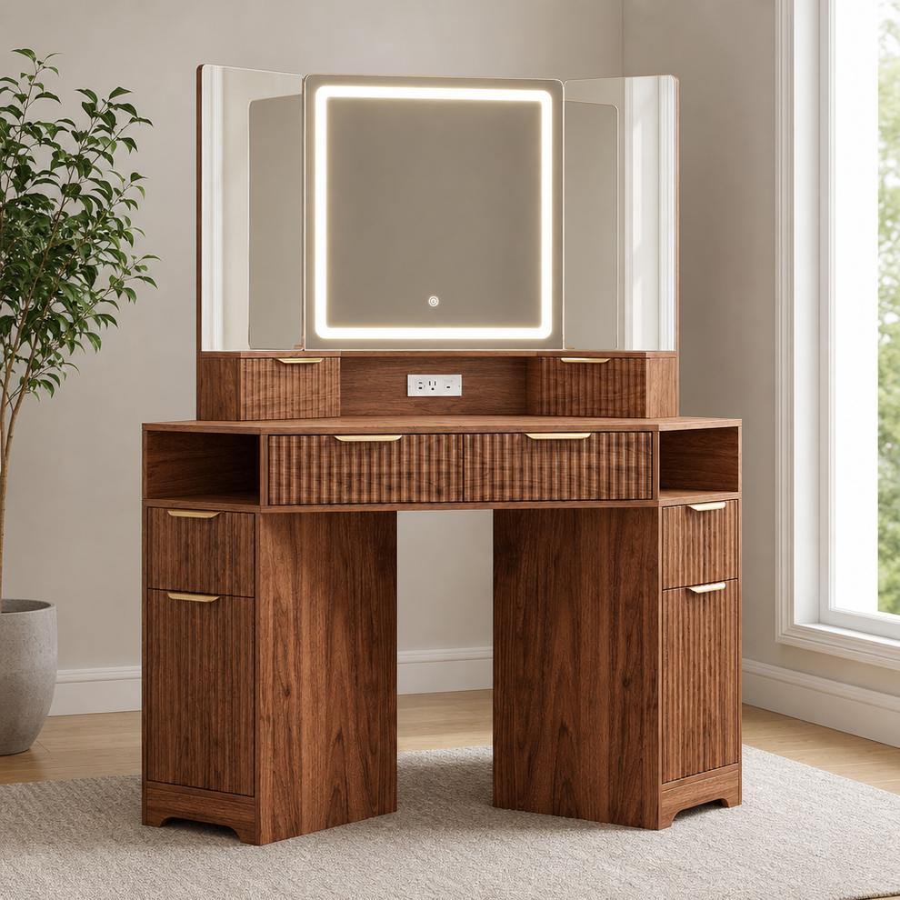 Corner Makeup Vanity Desk with Tri-Fold HD LED Mirror, 6 Drawers & Built-In Power  centered in a warm neutral furnished room