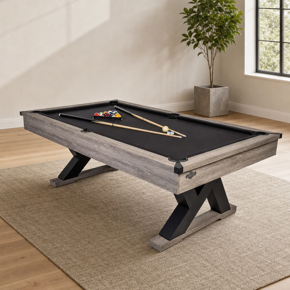 90-Inch Rustic Farmhouse Billiard Table with K-Shaped Legs and Black Cloth centered in a warm neutral furnished room