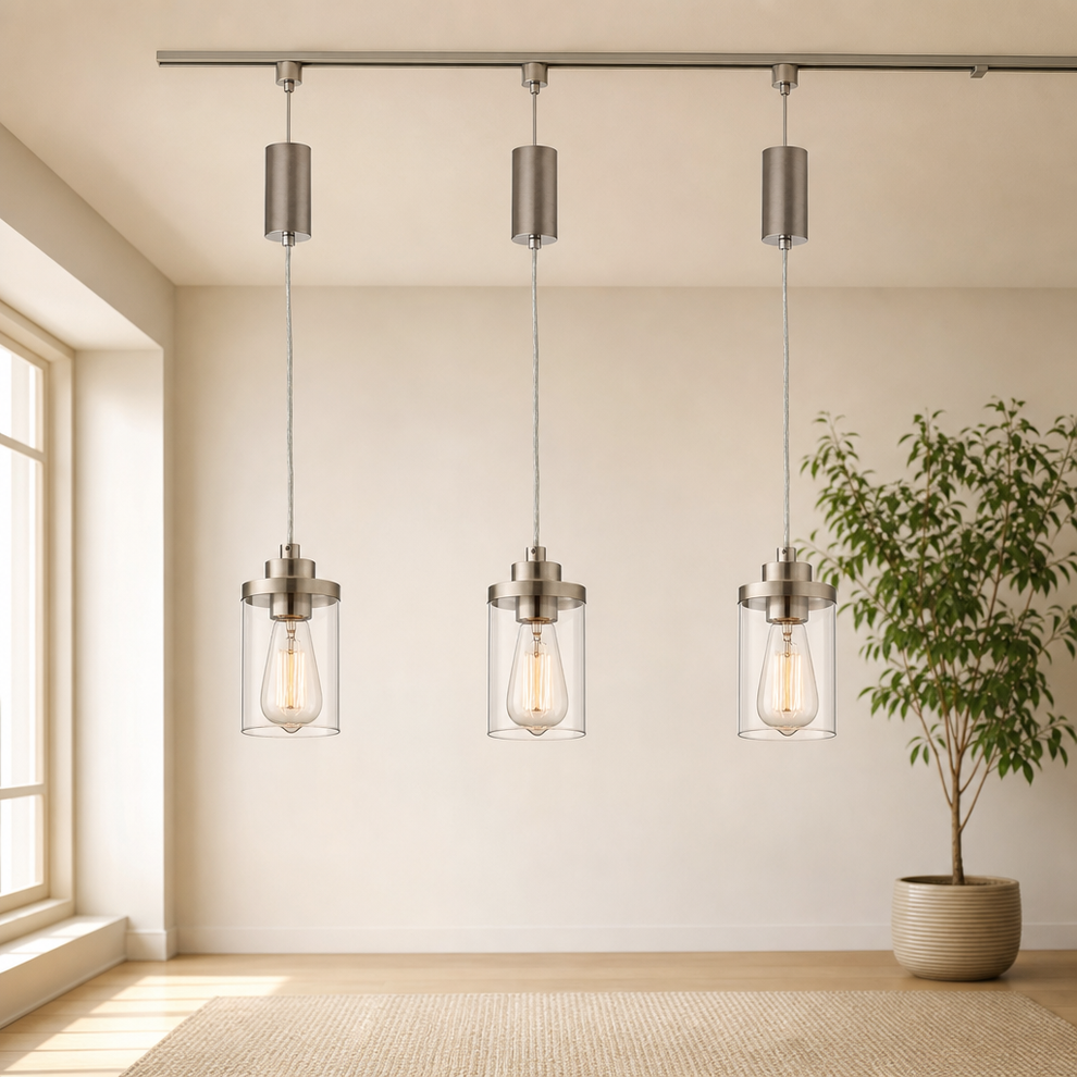 H-Type Track Pendant with Clear Glass Shade — Brushed Nickel or Black centered in a warm neutral furnished room