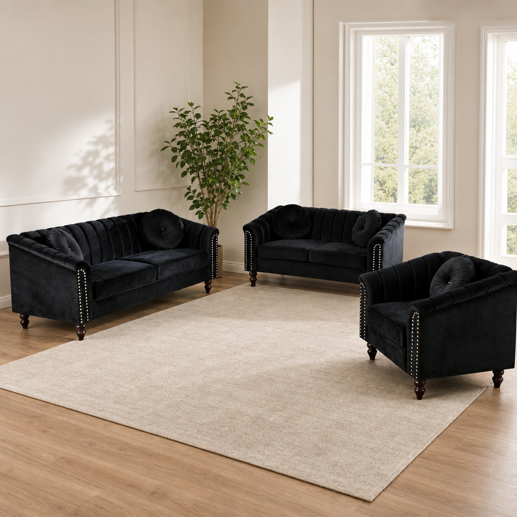 3-Piece Velvet Chesterfield Sofa Set — 3-Seat Sofa, Loveseat & Armchair, Black centered in a warm neutral furnished room