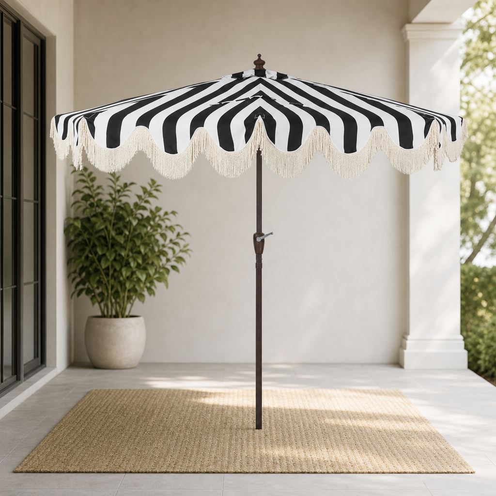 Half Patio Umbrella with Scalloped Edge & Bullion Fringe, Black/White centered in a warm neutral furnished room