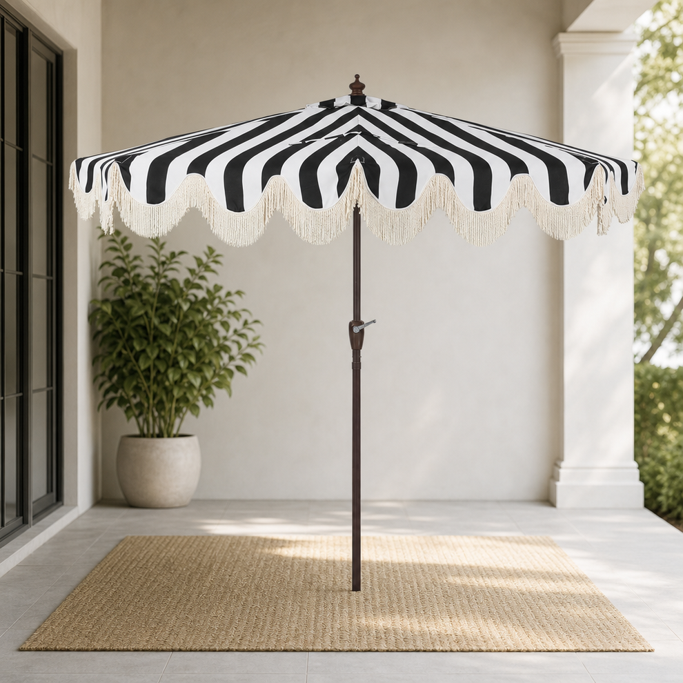 Half Patio Umbrella with Scalloped Edge & Bullion Fringe, Black/White centered in a warm neutral furnished room