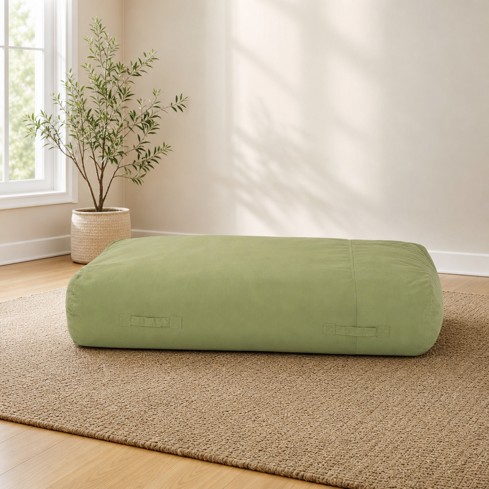 Christopher Knight Floor Lounger Bean Bag — Water-Resistant Green centered in a warm neutral furnished room