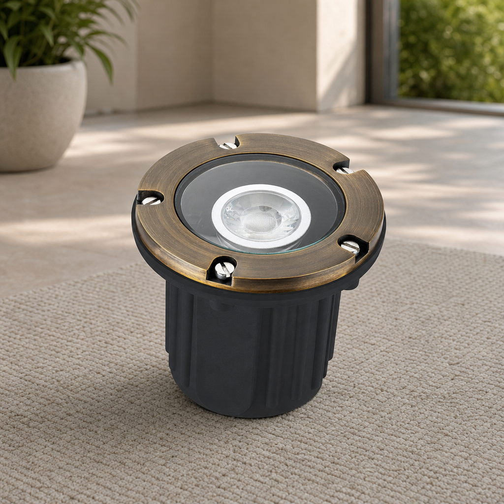 In-Ground Well Light — Die-Cast Brass Top, Antique Bronze, 3000K, 12V centered in a warm neutral furnished room