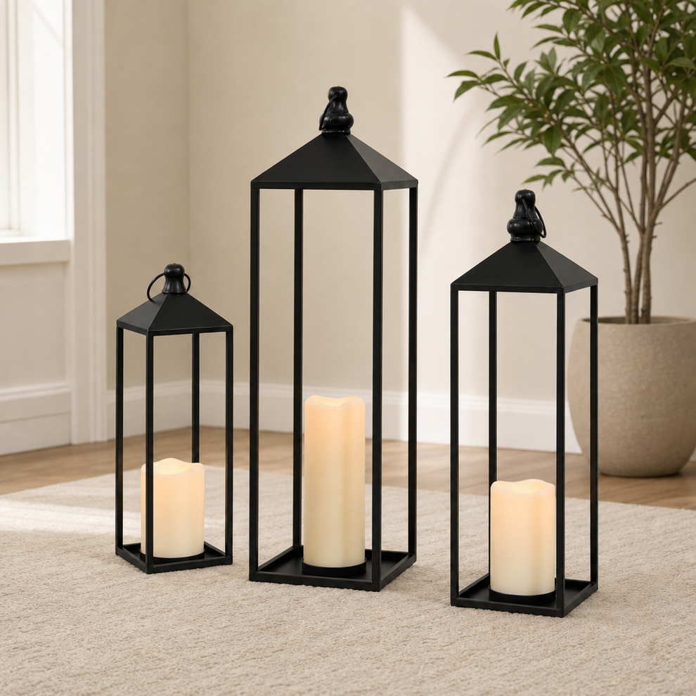 Metal Lantern Set with LED Flameless Candles, Black — 23 in, 19 in & 13 in centered in a warm neutral furnished room