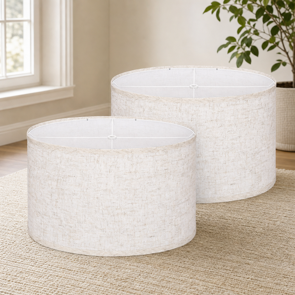 Oval Lampshade Set of 2 — Beige Linen, Spider Fitter, 16.5 x 11.5 x 11 in centered in a warm neutral furnished room