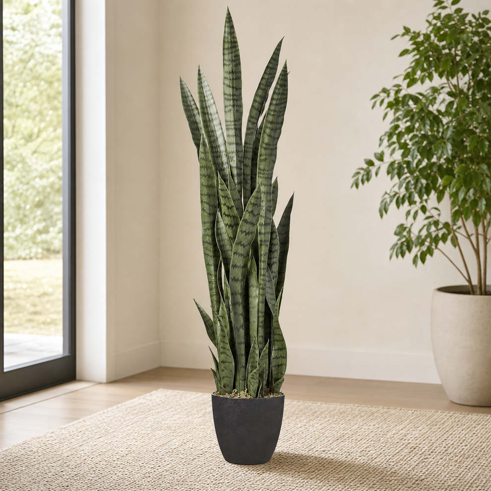 Sansevieria 48-inch Artificial Floor Plant with Weighted Planter centered in a warm neutral furnished room