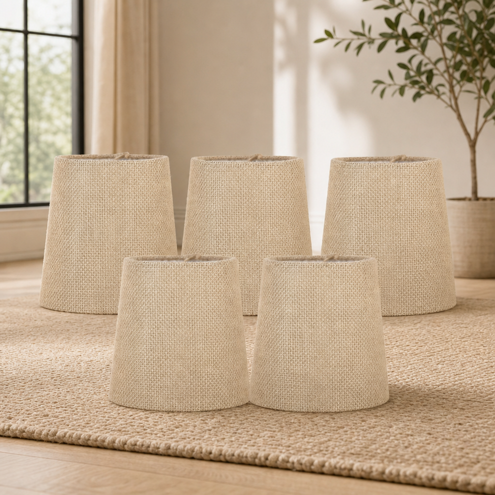 Clip-On Burlap Chandelier Shades, Natural — 4" top × 5" bottom × 5" high centered in a warm neutral furnished room