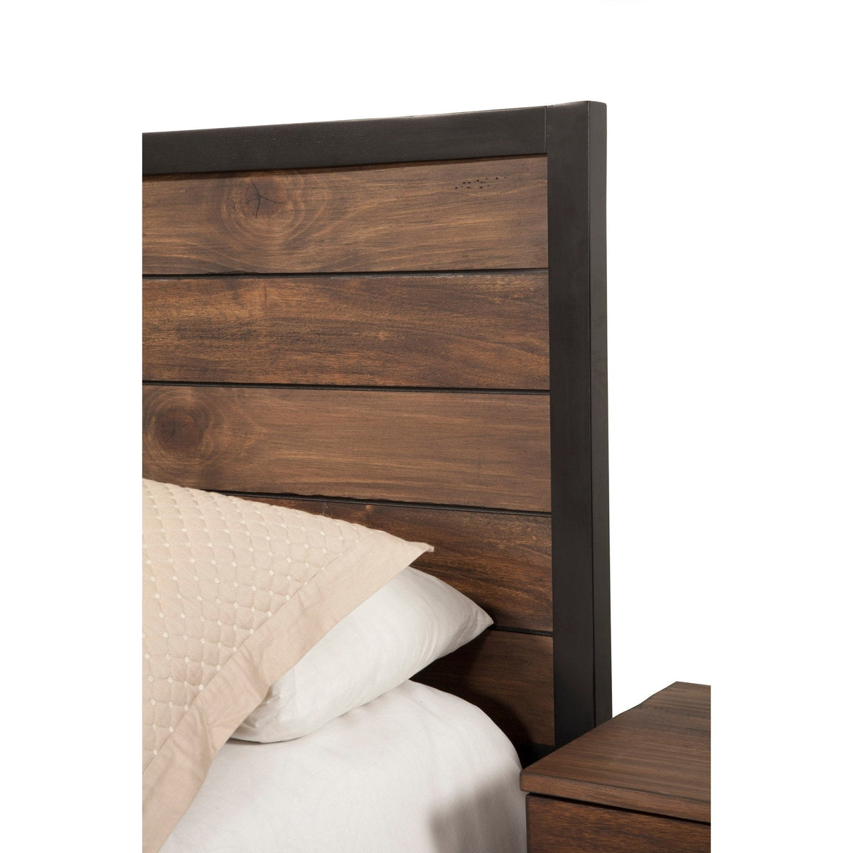 Headboard corner detail showing dark wood panels and a black frame